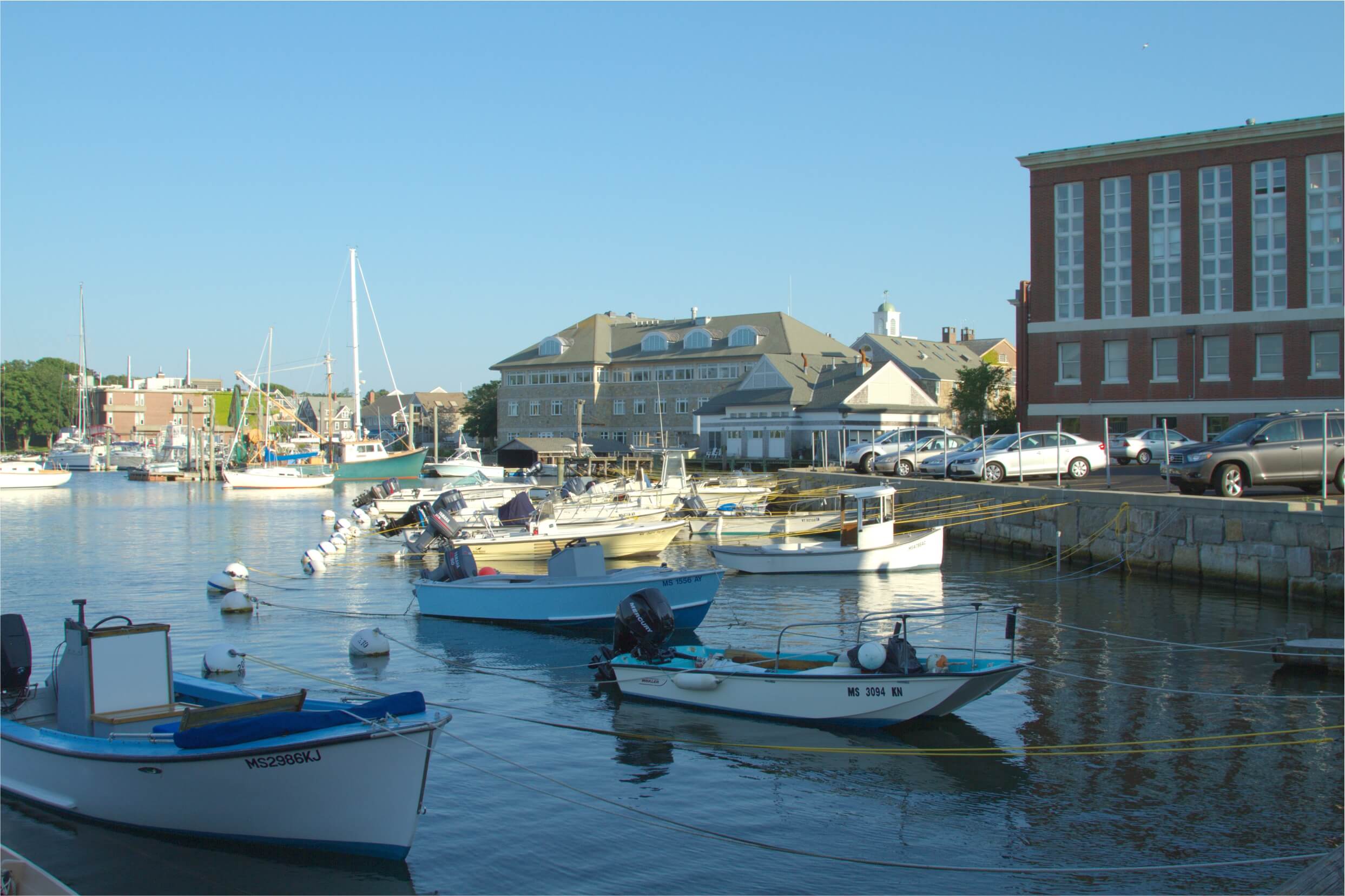 Croucher | View of WHOI and MBL buildings from across Eel
                    Pond
